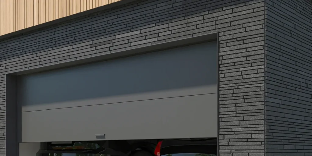 Contemporary dark grey flush panel garage door.